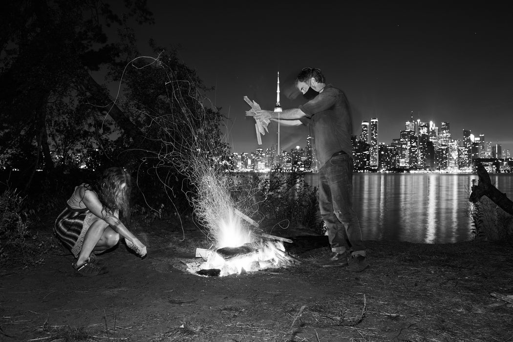 He Stokes The Fire Showering Her With Sparks