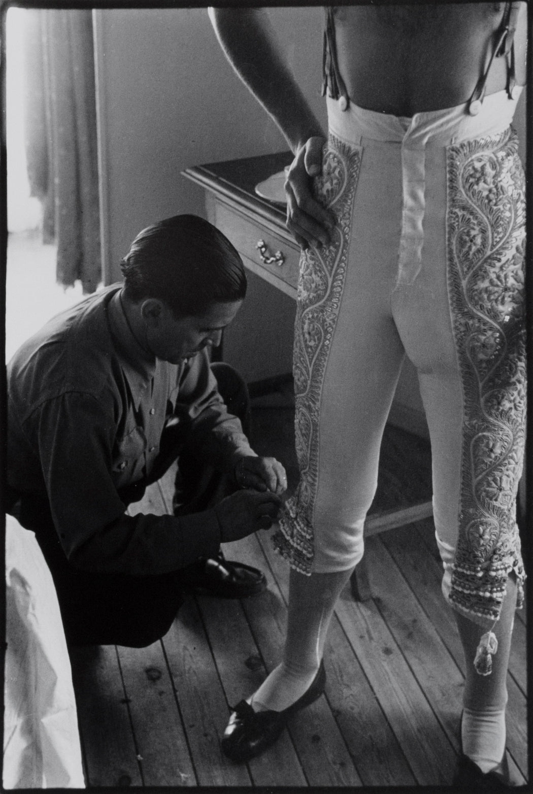 FFOTO-Inge Morath-Dressing of the Bullfighter Antonio Ordóñez for the afternoon corrida, Fiesta of San Fermin, Pamplona, Spain