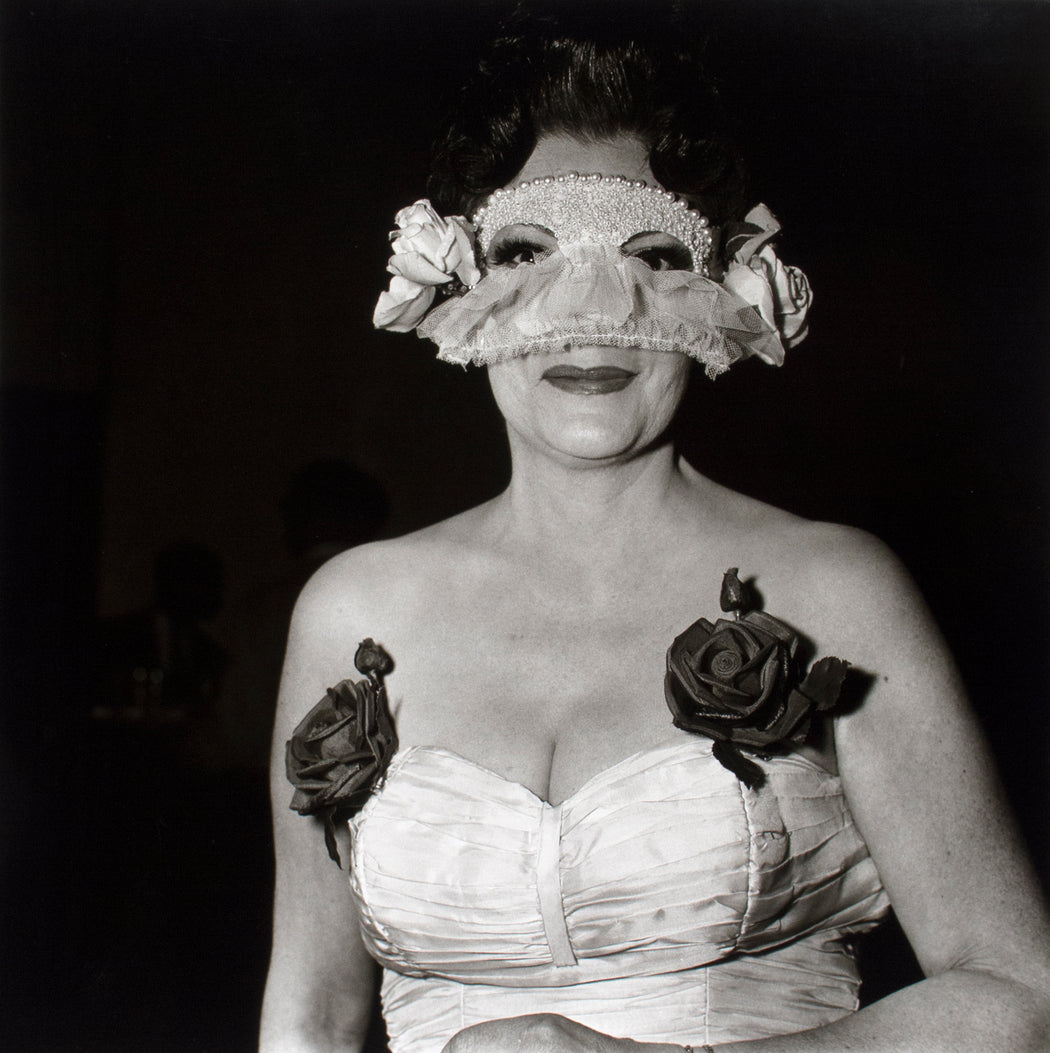 Lady at a masked ball with two roses on her dress, NYC,