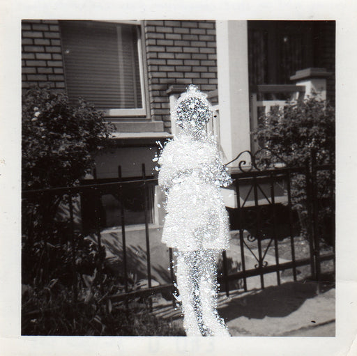 Young girl in first communion dress and white gloves