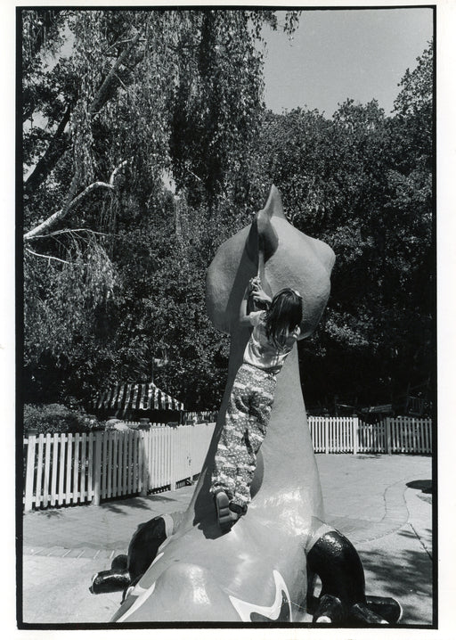 Untitled, Oakland [little girl on back of fake animal]