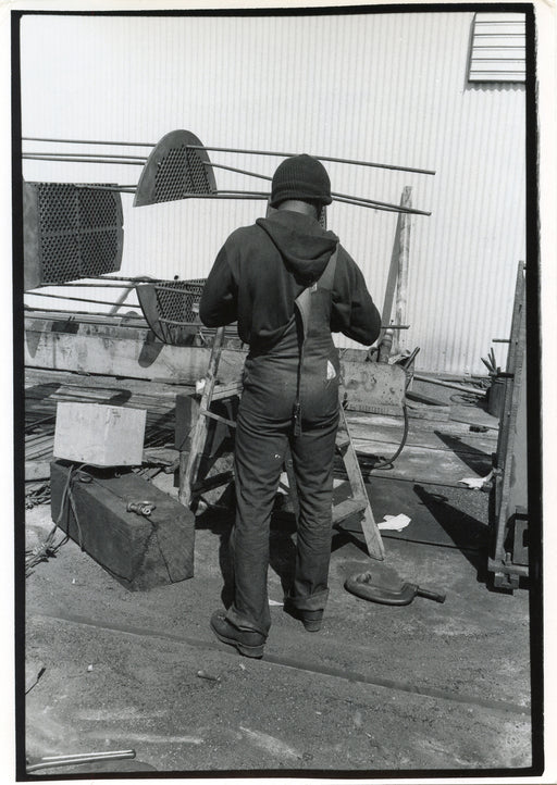 Untitled, Richmond, California [back of a working man, one suspender undone]