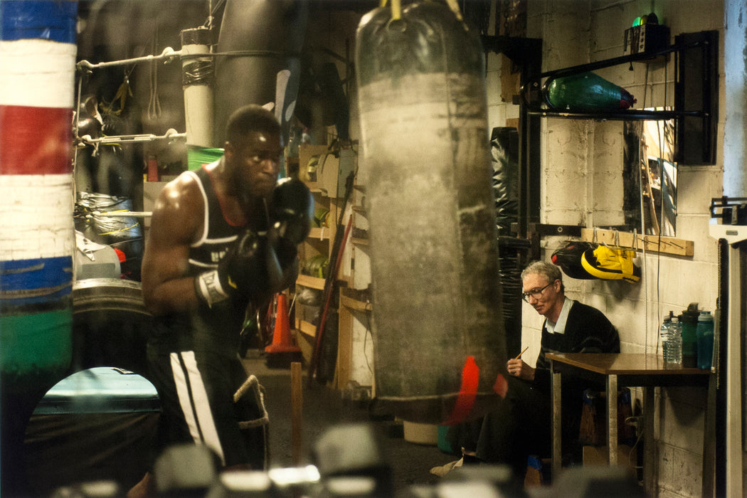 Sully's Gym, Toronto, Ontario, [man sketching boxer during his training]