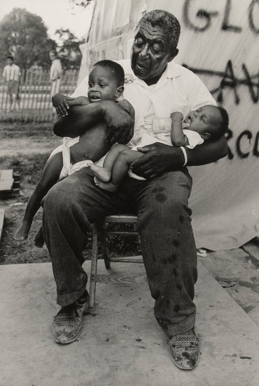 Untitled [A grandfather holds his two grandchildren in Resurrection City, Washington D.C.]