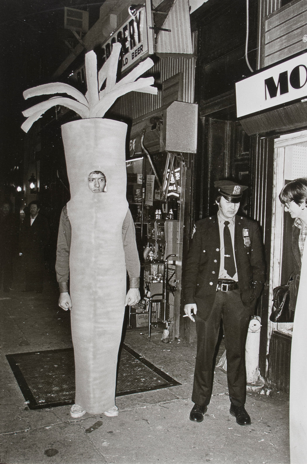 Untitled [Man in carrot costume with cop]