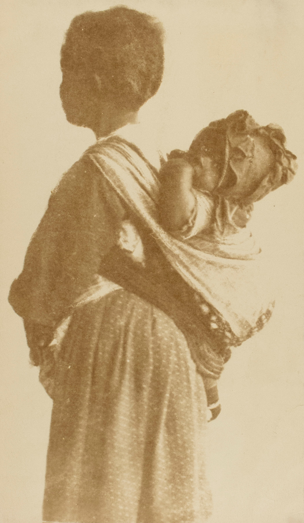 Untitled [Woman with baby in a sling]