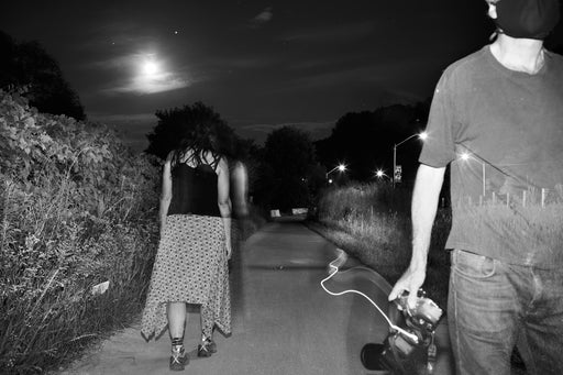 She Walks Away As He Fades Into The Landscape Under A Full Moon
