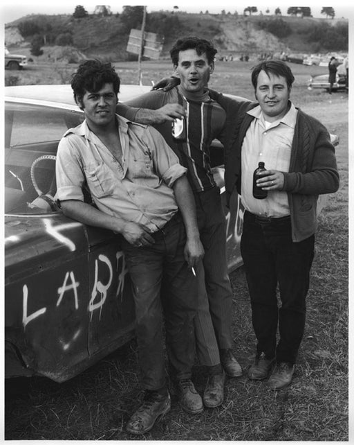 Luc Siamard, Édouard Guay, and Joseph Lajoie standing beside stock car, Saint-Urbain, Charlevoix