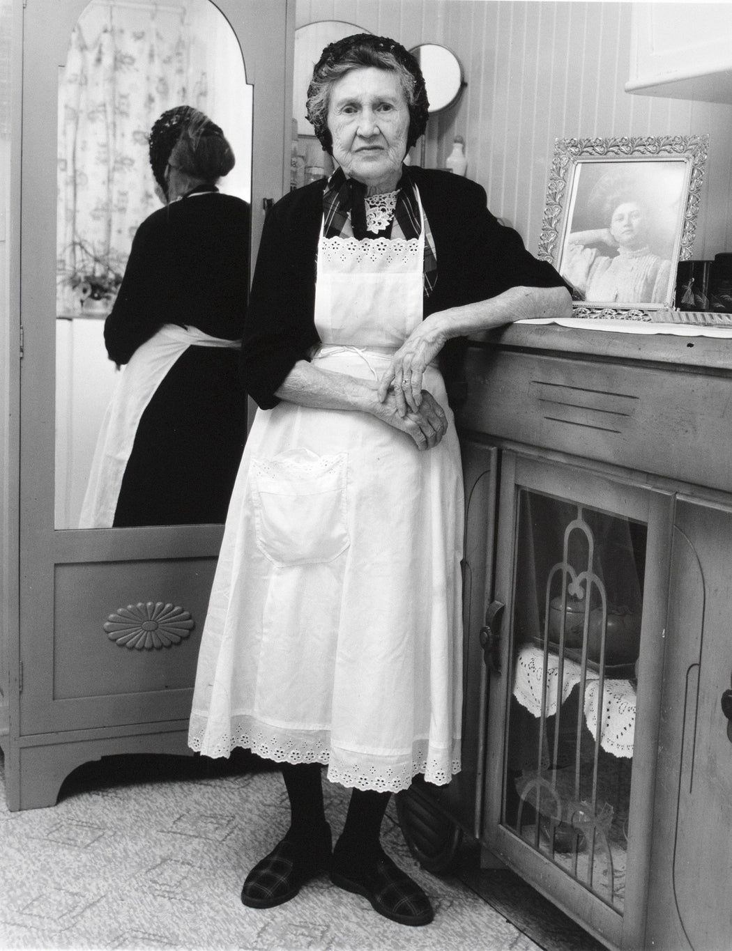 Mme Alexis (Marie) Tremblay in her bedroom, Île aux Coudres, Charlevoix